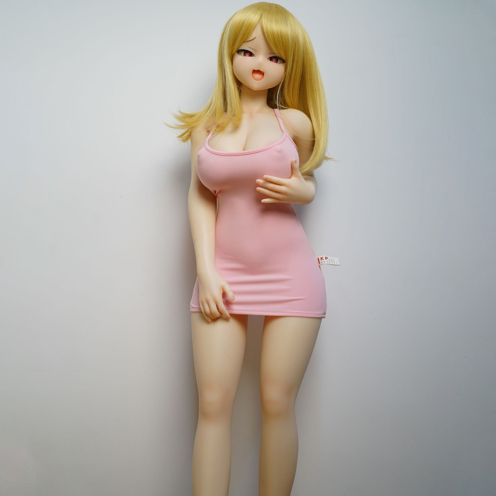 3ft 1in or 95cm tall mini Anime style silicone sex doll with large breasts and blonde hair in a tight pink outfit.  Made by Irokebijin.