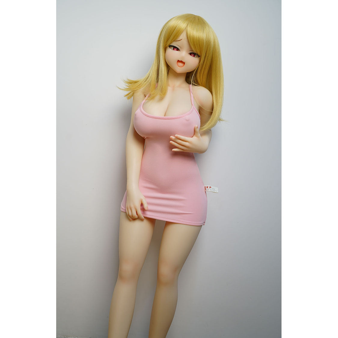 3ft 1in or 95cm tall mini Anime style silicone sex doll with large breasts and blonde hair in a tight pink outfit.  Made by Irokebijin.