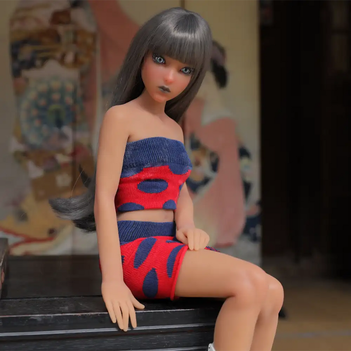 1ft 11in 60cm affordable mini female silicone sex doll with silver hair, blue eyes small breasts and a slim athletic figure.