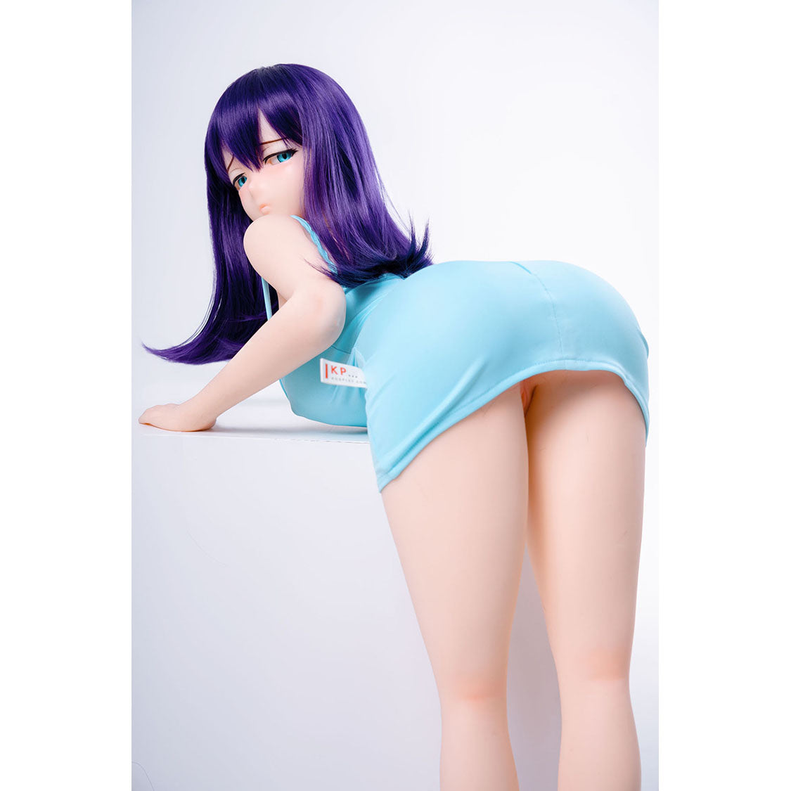 3ft 1in or 95cm tall mini Anime style silicone sex doll with large breasts, purple hair and blue eyes in a tight blue outfit.  Made by Irokebijin.