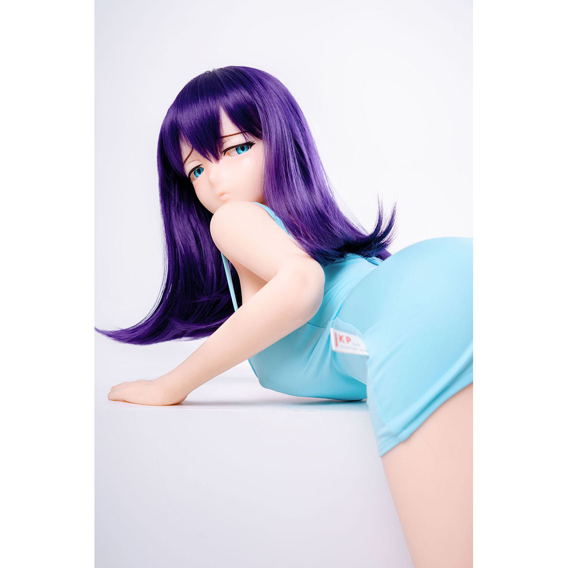 3ft 1in or 95cm tall mini Anime style silicone sex doll with large breasts, purple hair and blue eyes in tight blue outfit.  Made by Irokebijin.