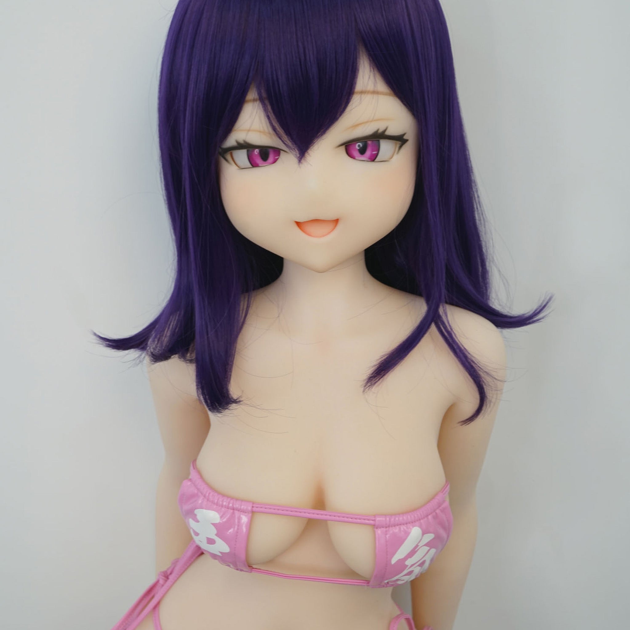 3ft 11in or 120cm tall Aki.  Anime TPE sex doll with large breasts, long dark blue hair, purple eyes and a pink and white bikini. Made by Irokebijin.