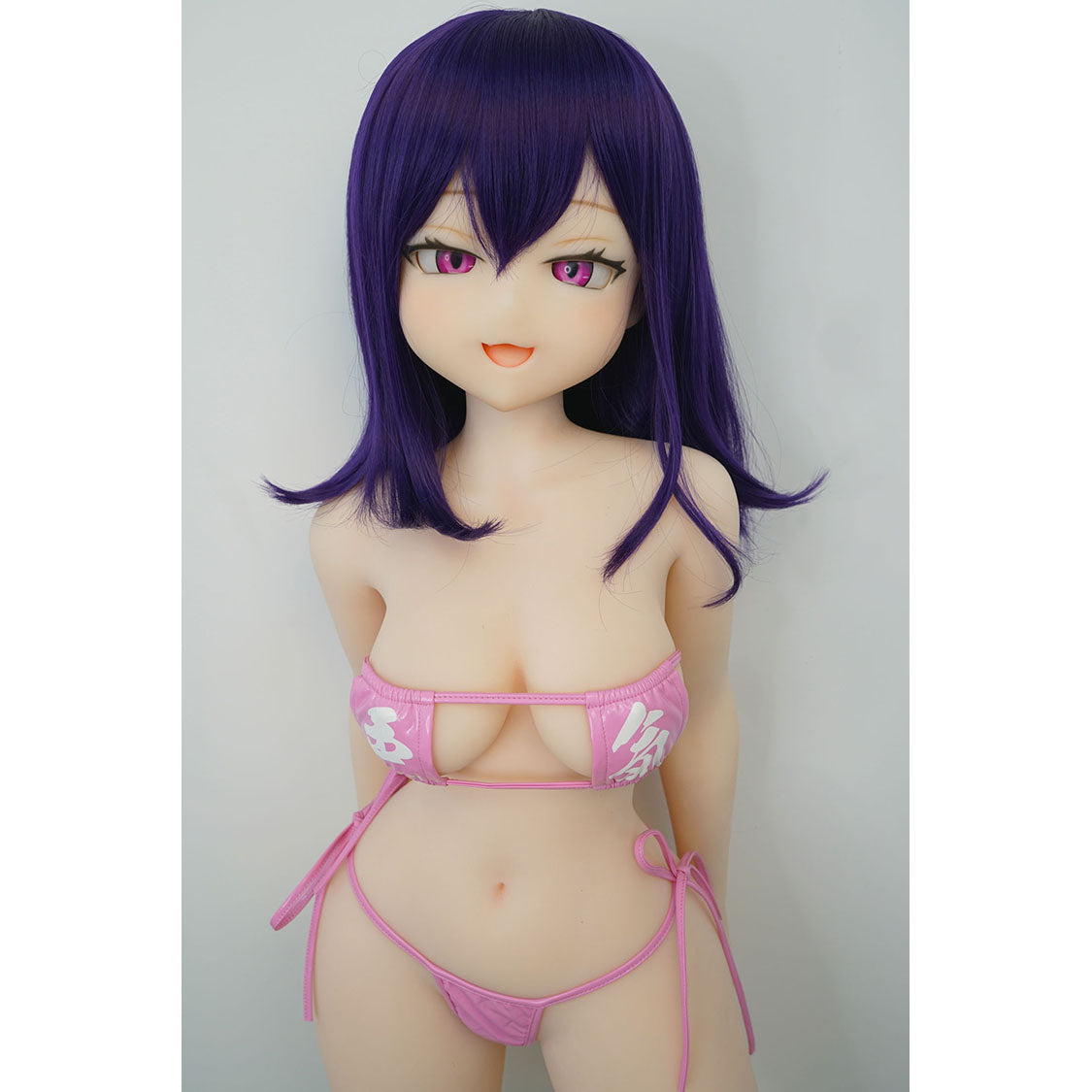 3ft 11in or 120cm tall Aki.  Anime TPE sex doll with large breasts, long dark blue hair, purple eyes and a pink and white bikini. Made by Irokebijin.
