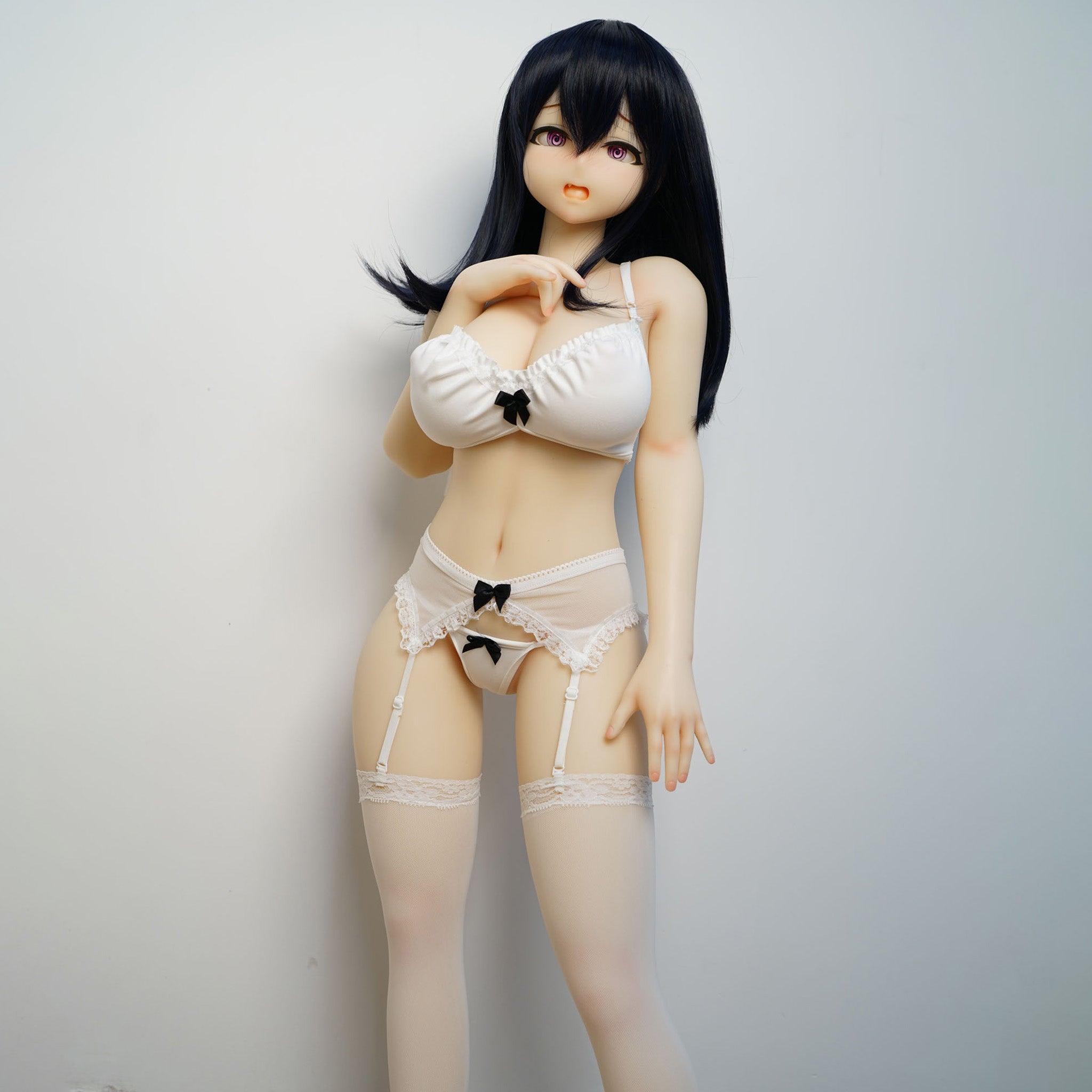 3ft 1in or 95cm tall mini Anime style silicone sex doll with large breasts, black hair and pink eyes in white lingerie.  Made by Irokebijin.