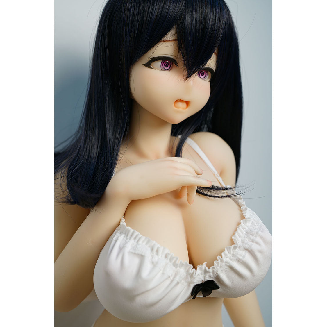 3ft 1in or 95cm tall mini Anime style silicone sex doll with large breasts, black hair and pink eyes in white lingerie.  Made by Irokebijin.