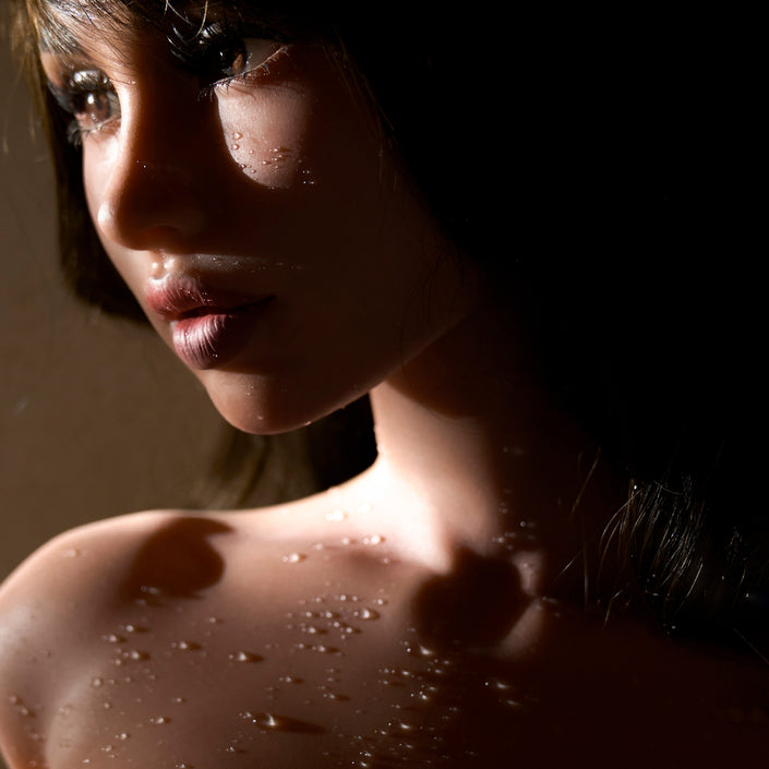 Close up portrait of ULW 882 Morgan silicone torso doll displaying detailed facial sculpt and lifelike makeup