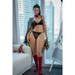 Irontech Tyra 164cm premium silicone companion doll seated in black lingerie with red heels and natural lifelike expression