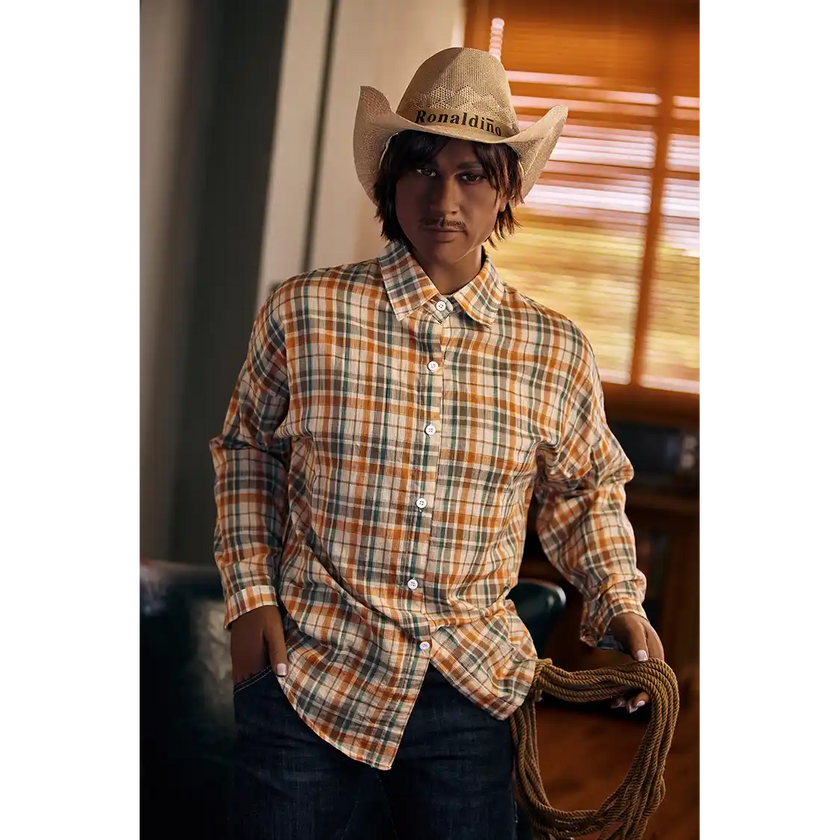 5ft 9in 175cm muscular dark skinned Asian male sex doll with dark hair, and a large penis dressed in a cowboy outfit.