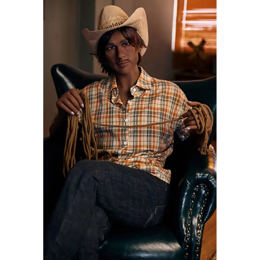 5ft 9in 175cm muscular dark skinned Asian male sex doll with dark hair, and a large penis dressed in a cowboy outfit.
