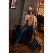 5ft 9in 175cm muscular dark skinned Asian male sex doll with dark hair, and a large penis dressed in a cowboy outfit.