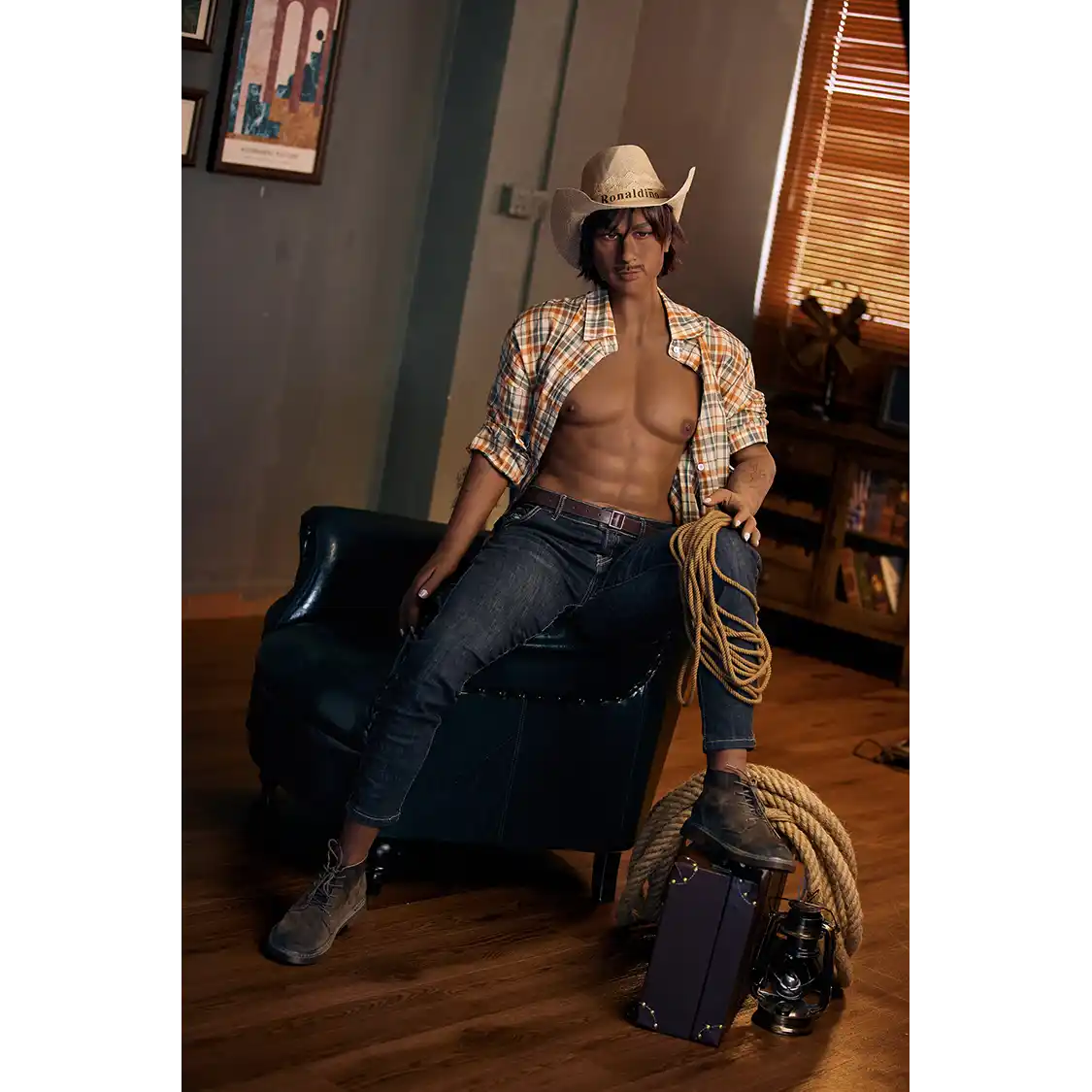 5ft 9in 175cm muscular dark skinned Asian male sex doll with dark hair, and a large penis dressed in a cowboy outfit.