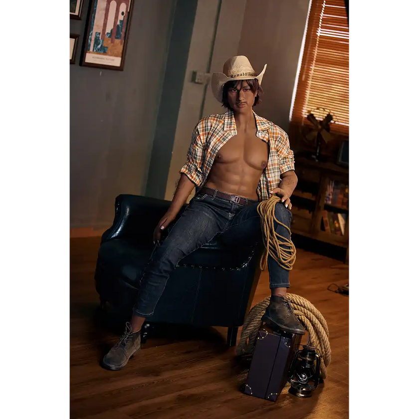 5ft 9in 175cm muscular dark skinned Asian male sex doll with dark hair, and a large penis dressed in a cowboy outfit.