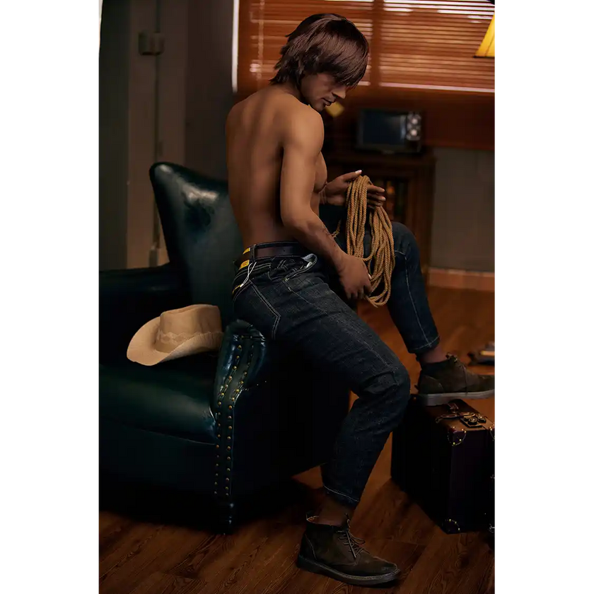 5ft 9in 175cm muscular dark skinned Asian male sex doll with dark hair, and a large penis dressed in a cowboy outfit.