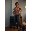 5ft 9in 175cm muscular dark skinned Asian male sex doll with dark hair, and a large penis dressed in a cowboy outfit.