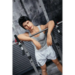 5ft 4in 162cm muscular Asian male sex doll with dark hair and a large penis in a tank top and shorts.