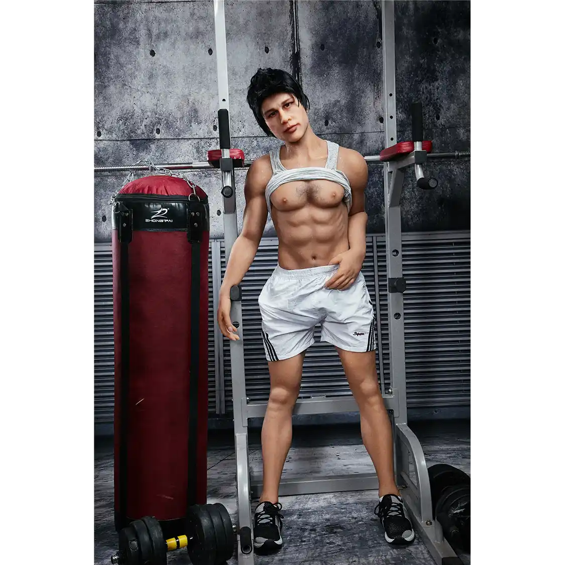 5ft 4in 162cm muscular Asian male sex doll with dark hair and a large penis in a tank top and shorts.