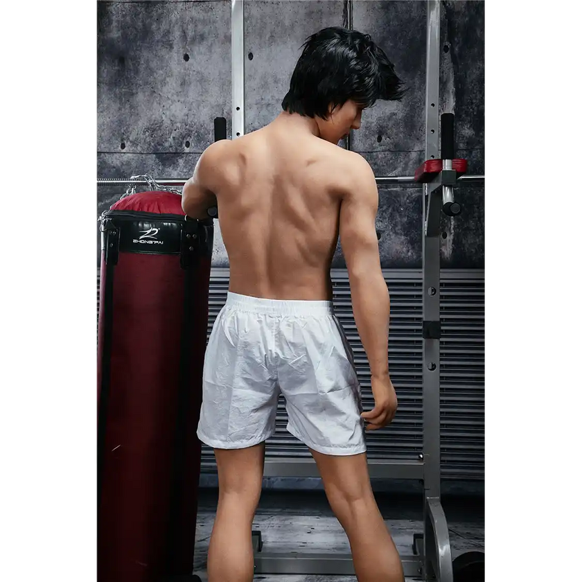5ft 4in 162cm muscular Asian male sex doll with dark hair and a large penis in a tank top and shorts.