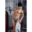 5ft 4in 162cm muscular Asian male sex doll with dark hair and a large penis in a tank top and shorts.