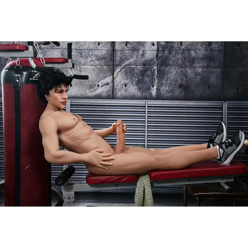 5ft 4in 162cm muscular Asian male sex doll with dark hair and a large penis in a tank top and shorts.