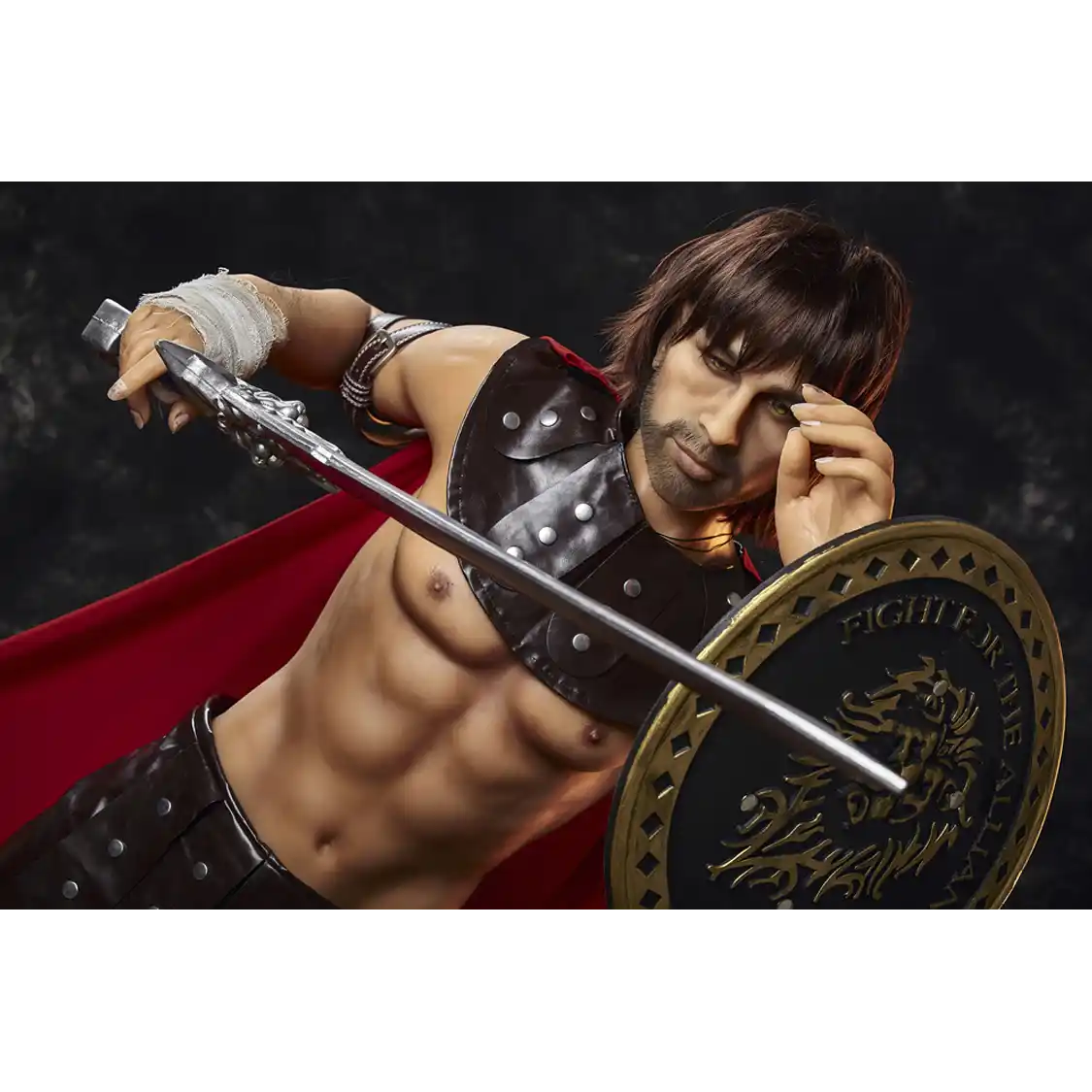 5ft 4in 162cm muscular White DILF sex doll with shaggy dark hair, stubble and a large penis in a gladiator outfit.