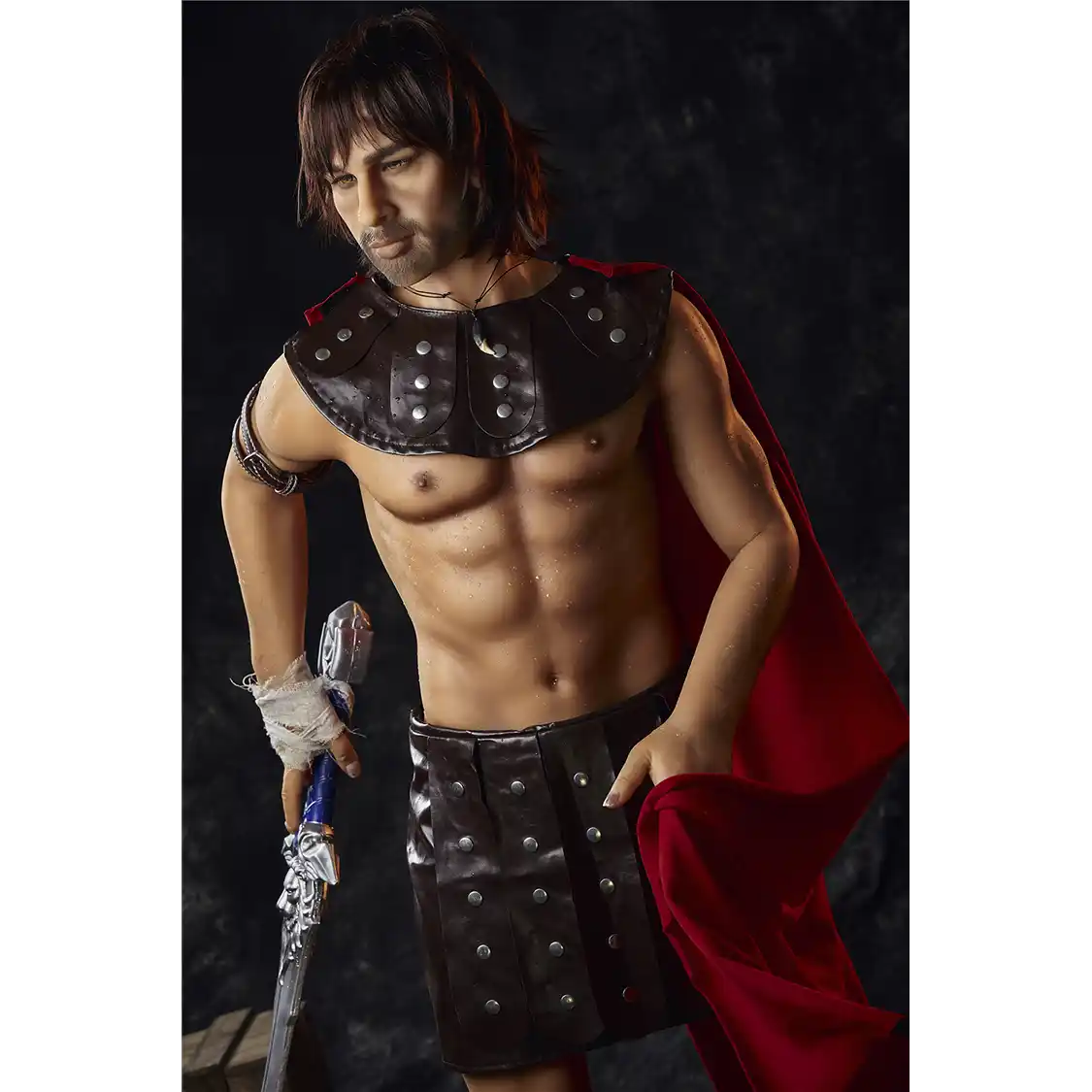 5ft 4in 162cm muscular White DILF sex doll with shaggy dark hair, stubble and a large penis in a gladiator outfit.