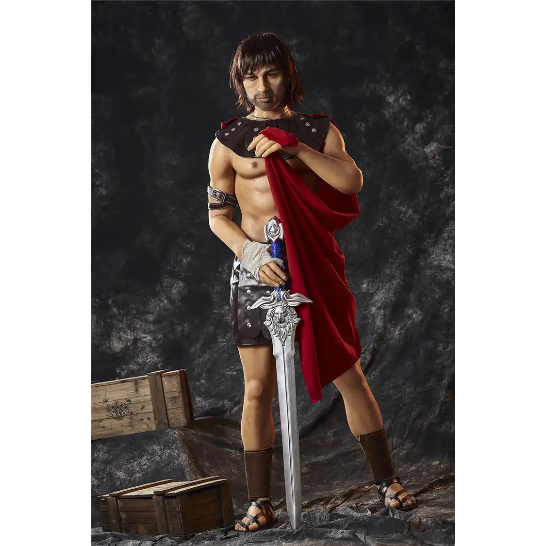 5ft 4in 162cm muscular White DILF sex doll with shaggy dark hair, stubble and a large penis in a gladiator outfit.