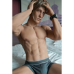 5ft 7in 170cm muscular white male sex doll with abs, giant penis and blonde hair and blue eyes in gray underwear made by Doll Forever.