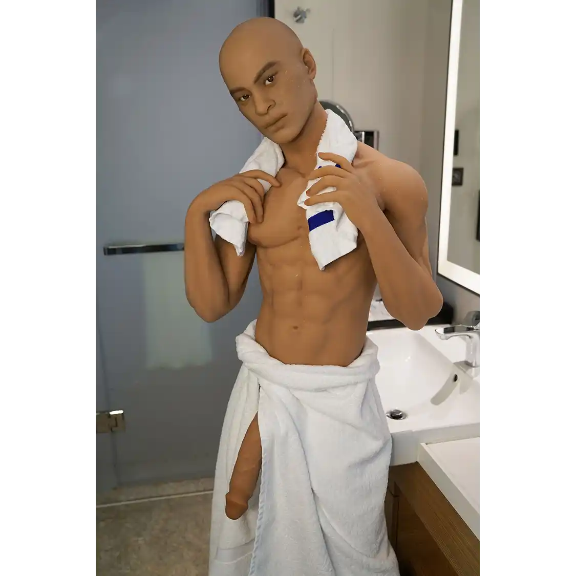 5ft 7in 170cm muscular Black male sex doll with abs, giant penis and blonde hair and blue eyes in gray underwear made by Doll Forever.