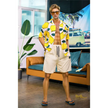 5ft 9in 176cm muscular White male sex doll with a large penis in a Hawaiian shirt and beige shorts.