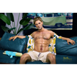 5ft 9in 176cm muscular White male sex doll with a large penis in a Hawaiian shirt and beige shorts.