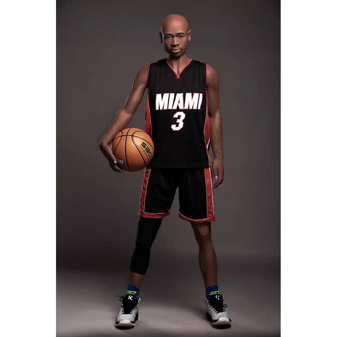 5ft 9in 175cm muscular Black male sex doll bald with a large penis dressed in a basketball outfit.