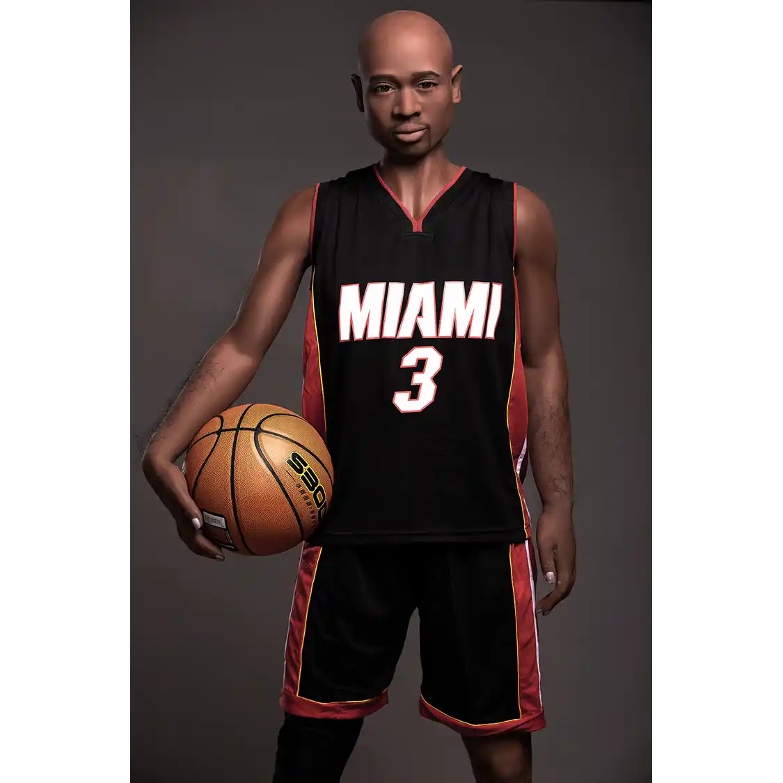 5ft 9in 175cm muscular Black male sex doll bald with a large penis dressed in a basketball outfit.