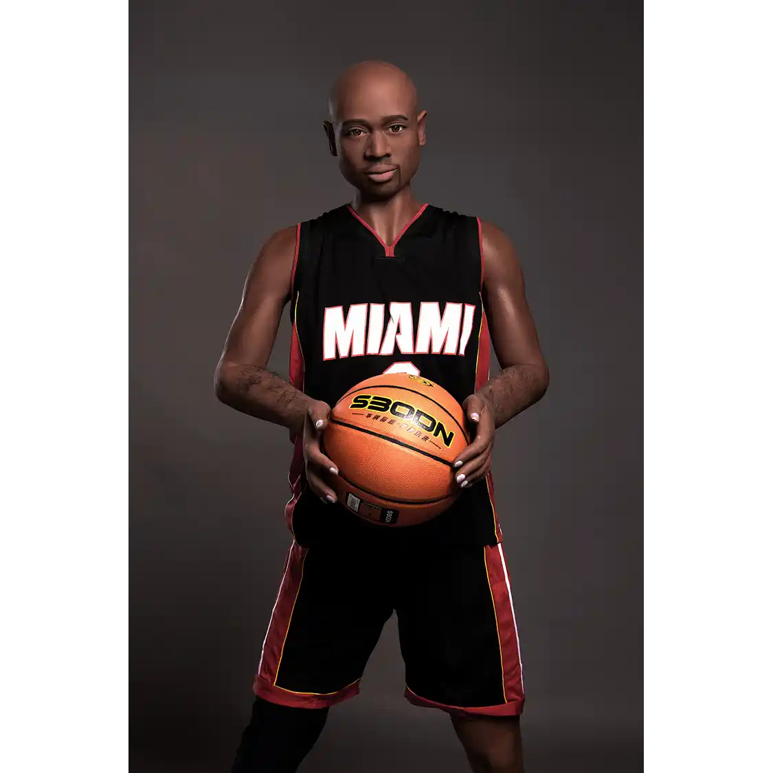 5ft 9in 175cm muscular Black male sex doll bald with a large penis dressed in a basketball outfit.