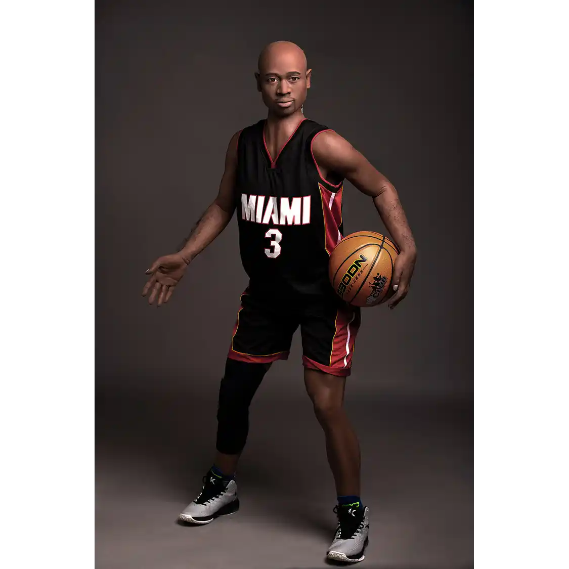 5ft 9in 175cm muscular Black male sex doll bald with a large penis dressed in a basketball outfit.