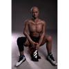 5ft 9in 175cm muscular Black male sex doll bald with a large penis dressed in a basketball outfit.