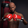 5ft 9in 175cm muscular Black male sex doll bald with a large penis dressed in a boxing outfit.