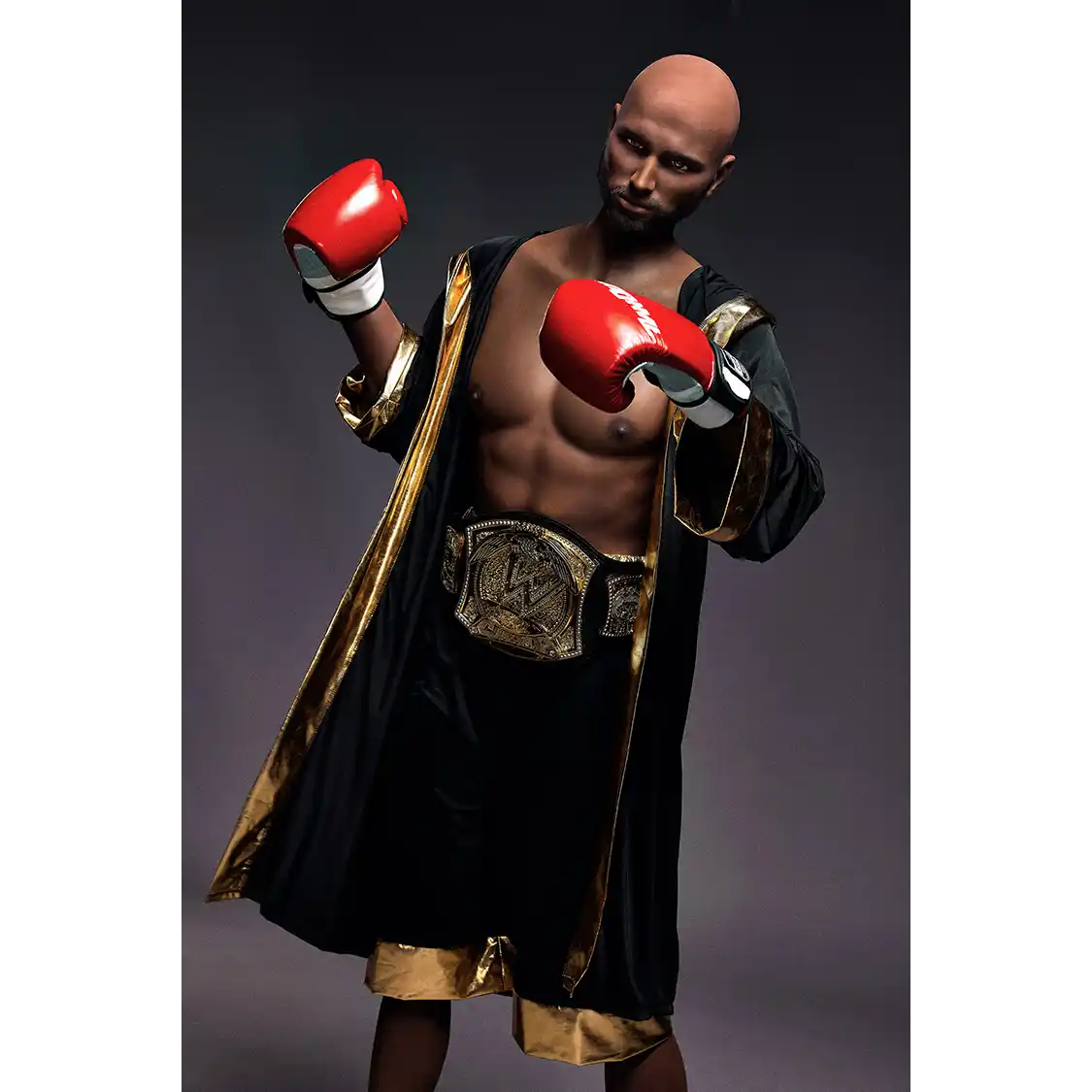 5ft 9in 175cm muscular Black male sex doll bald with a large penis dressed in a boxing outfit.