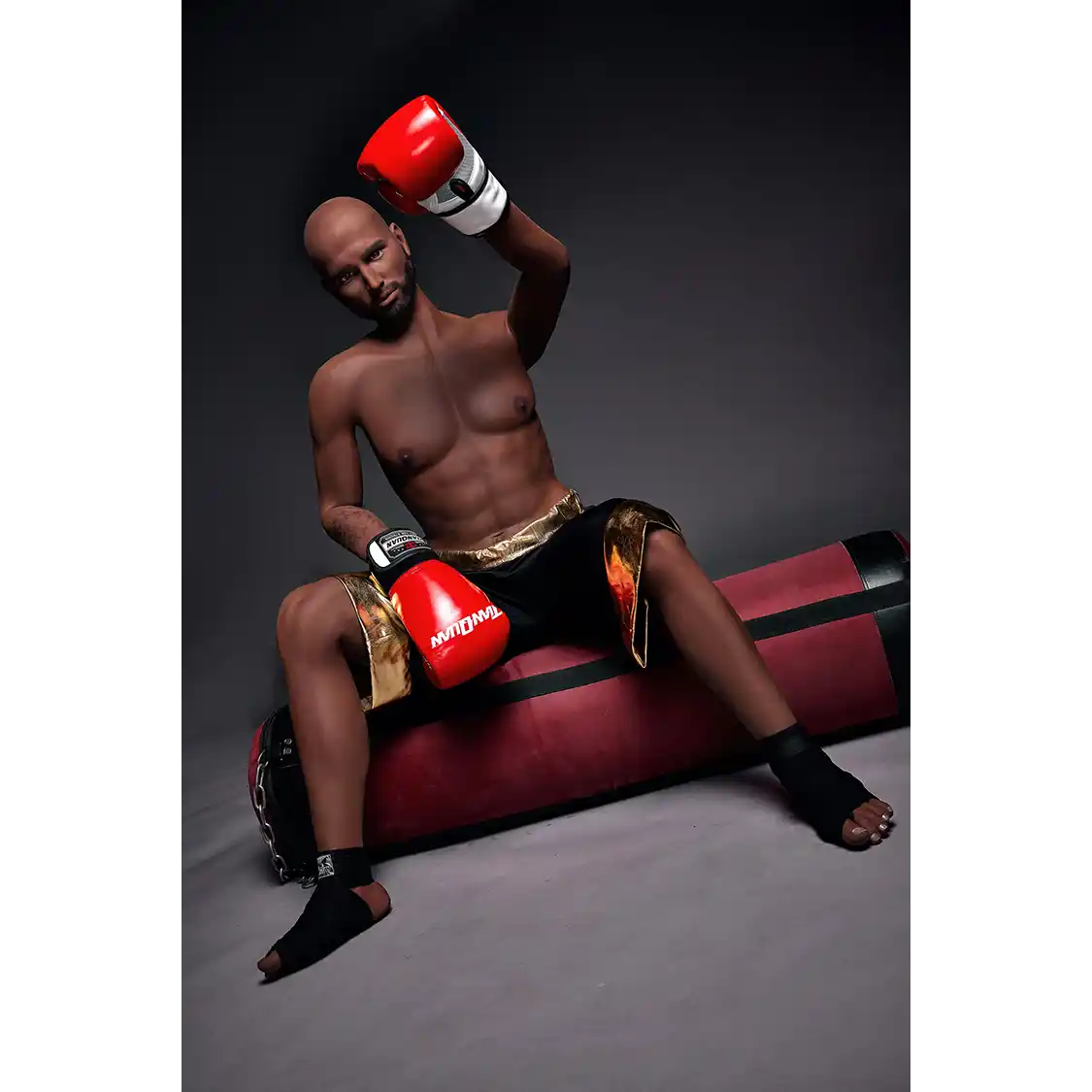 5ft 9in 175cm muscular Black male sex doll bald with a large penis dressed in a boxing outfit.