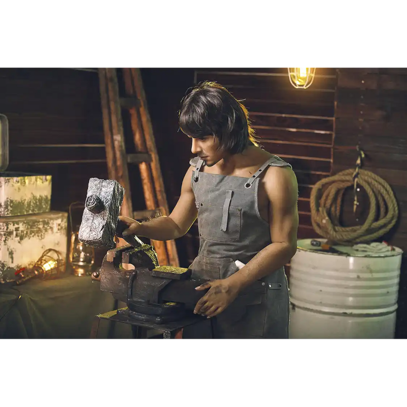 5ft 4in 162cm muscular White male sex doll with dark hair and a large penis in a blacksmiths outfit.