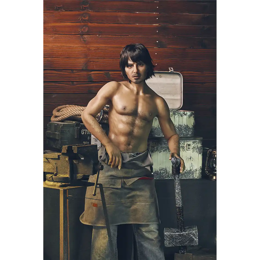 5ft 4in 162cm muscular White male sex doll with dark hair and a large penis in a blacksmiths outfit.