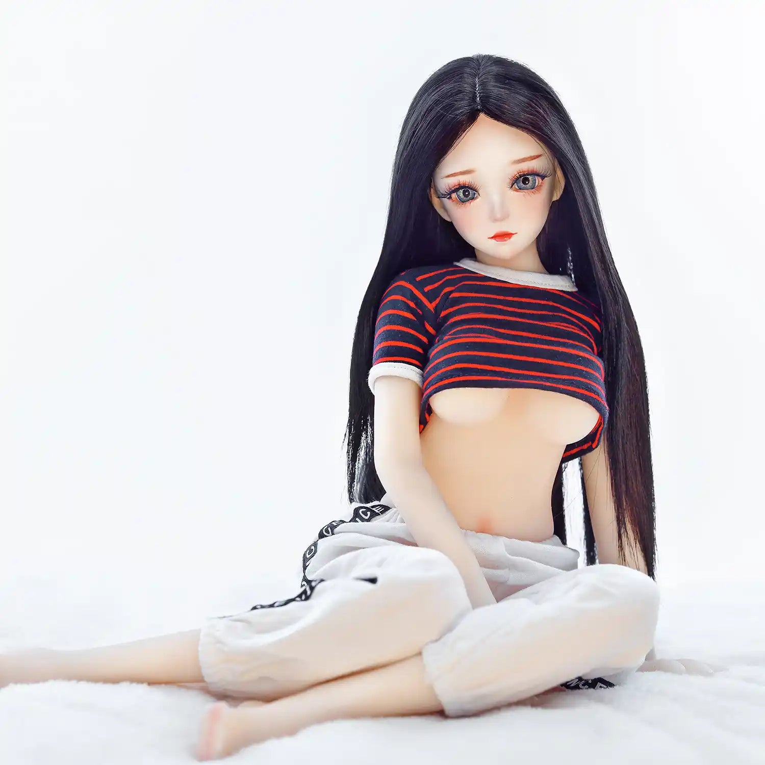 Christina, 60cm anime style mini sex doll with black hair and medium breasts.  Made by SY Doll.  