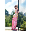 5ft 4in or 163cm curvy white female hybrid sex doll with long legs, long dark hair, large breasts, large butt, and brown eyes in a pink top and pink exercise pants.