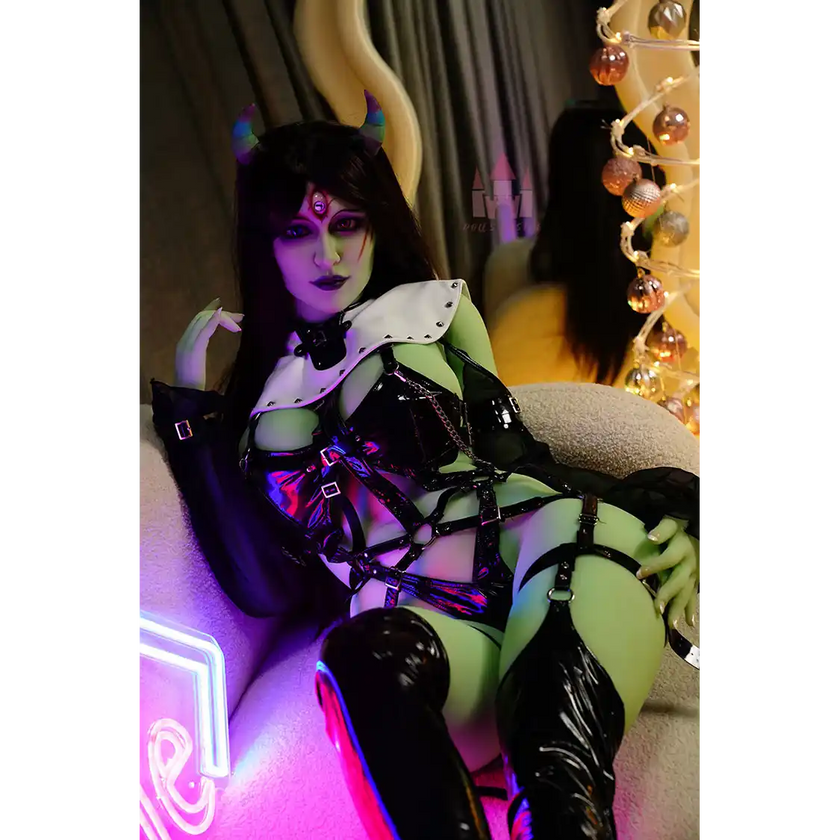 5ft 6in 168cm tall green alien TPE sex doll with large E-cup breasts, blue eyes and long black hair in a black sci-fi outfit.