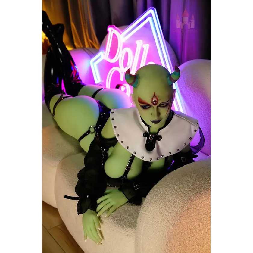 5ft 6in 168cm tall green alien TPE sex doll with large E-cup breasts, blue eyes and long black hair in a black sci-fi outfit.