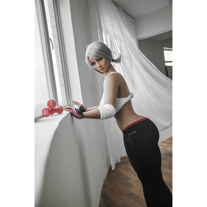 5ft 2in 158cm curvy Asian TPE sex doll with silver hair, large I cup breasts brown eyes and tanned skin in sports bra and tight pants.