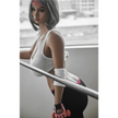 5ft 2in 158cm curvy Asian TPE sex doll with silver hair, large I cup breasts brown eyes and tanned skin in sports bra and tight pants.