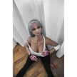 5ft 2in 158cm curvy Asian TPE sex doll with silver hair, large I cup breasts brown eyes and tanned skin in sports bra and tight pants.