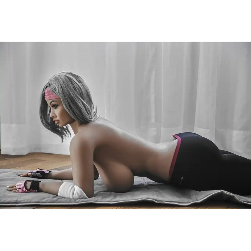 5ft 2in 158cm curvy Asian TPE sex doll with silver hair, large I cup breasts brown eyes and tanned skin in sports bra and tight pants.