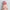 2ft 60cm mini anime sex doll Azami. Silicone body construction, giant breasts, fair skin, pink hair and a sexy curvy body in a pink blouse.