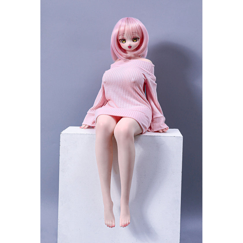 2ft 60cm mini anime sex doll Azami. Silicone body construction, giant breasts, fair skin, pink hair and a sexy curvy body in a pink blouse.